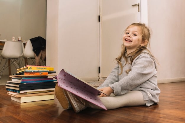 A five-year-old child sitting cross-legged surrounded by books from an Amazon Prime Book Box. The child is smiling and engaged with a colorful picture book. The scene conveys the joy of reading.
