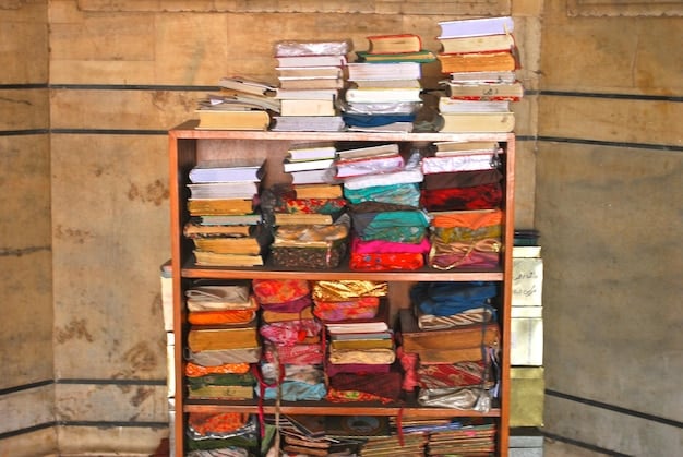 A bookshelf filled with brightly colored books of diverse genres, including fiction, non-fiction, graphic novels, and poetry. The books are arranged in an appealing and organized manner.
