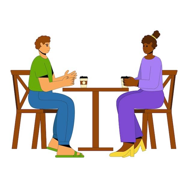 Two people sitting across from each other, engaged in a calm and productive conversation. They are making eye contact and listening attentively to each other. A whiteboard with diagrams and talking points is visible in the background.