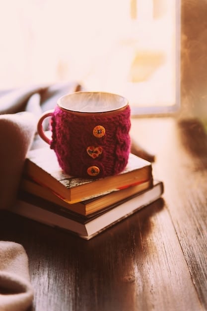 A close-up shot of a stack of diverse books on a wooden table, with a warm cup of coffee beside them. The lighting is soft and inviting, creating a sense of anticipation and pleasant reading moments.