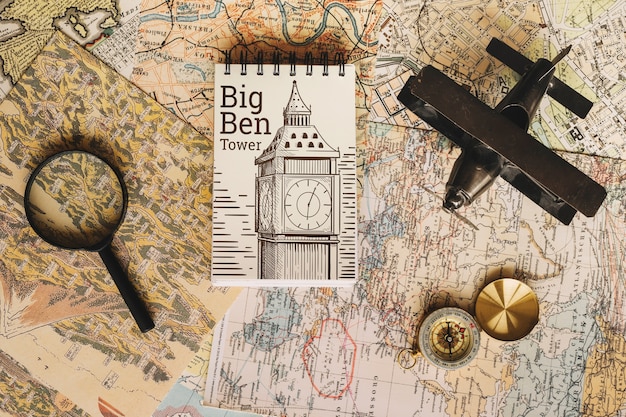 A close-up of an old map with annotations, highlighting specific locations and routes relevant to a historical novel's setting. The map is partially obscured by a magnifying glass.