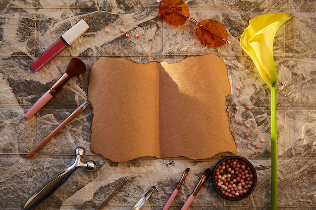 An open book with a bookmark placed halfway through, set against a background of vintage maps and a quill pen. The lighting highlights the texture of the paper and the intricate details of the maps.