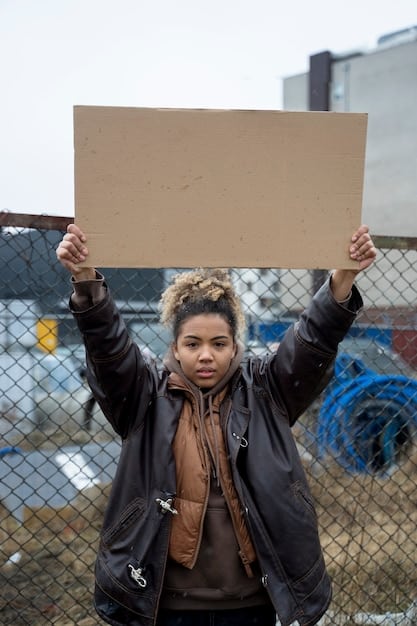 An image depicting protesters holding signs related to economic inequality and social justice in front of Wall Street. This symbolizes the challenges to the American Dream narrative.