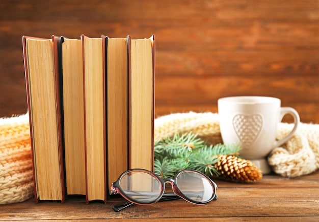 A stack of books arranged neatly on a wooden table, with a pair of reading glasses resting on top. The lighting is warm and inviting, creating a cozy atmosphere.