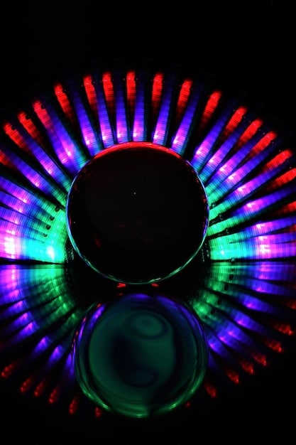 Sound waves emanating from a speaker in a darkened theater, with abstract, colorful patterns representing the auditory experience and the impact of sound on the audience's perception.