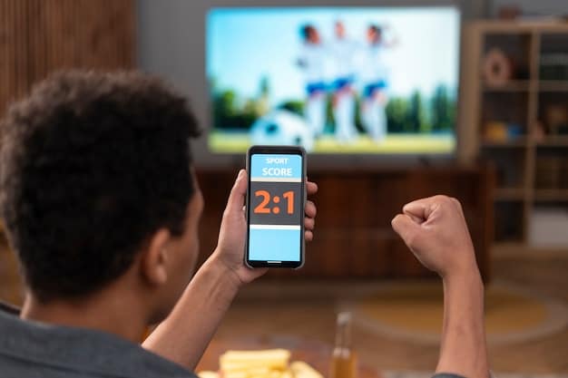 A person setting a timer on their phone next to a TV remote. The TV screen displays a paused streaming show. The image emphasizes the conscious effort to manage viewing time.