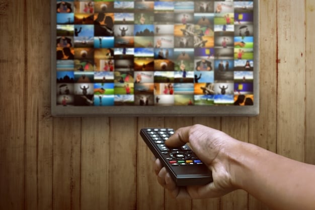 A smart TV displaying a free streaming service's app, with different shows and movies highlighted. Various other streaming apps are also visible on the TV's main menu.