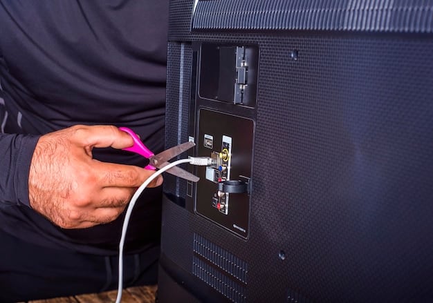 A person connecting an HDMI cable to the back of a 4K television. Various ports and connections are visible, with labels indicating HDMI 2.1 and eARC support.