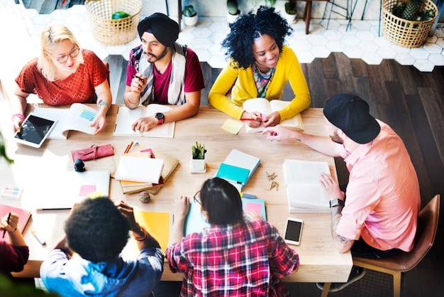 A diverse group of students engaged in a lively and collaborative discussion around a table filled with books and digital tablets, symbolizing a blend of traditional and modern learning. The atmosphere is intellectual and curious.