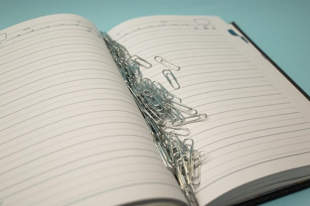 A close-up shot of a notebook with handwritten notes and highlighted passages from a book. The notebook is open to a page with headings like 
