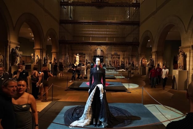 A backstage view of a Broadway production showing elaborate costumes and stage sets. Actors are preparing for a scene, but the main focus is on the intricate and expensive details of the production. This image relates to the high production costs involved in 