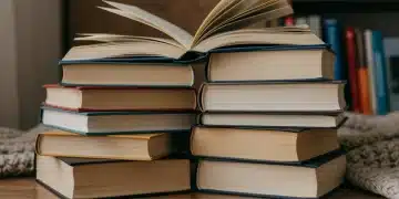 Seven diverse, intriguing books stacked on a wooden surface, suggesting hidden literary gems for 2026.